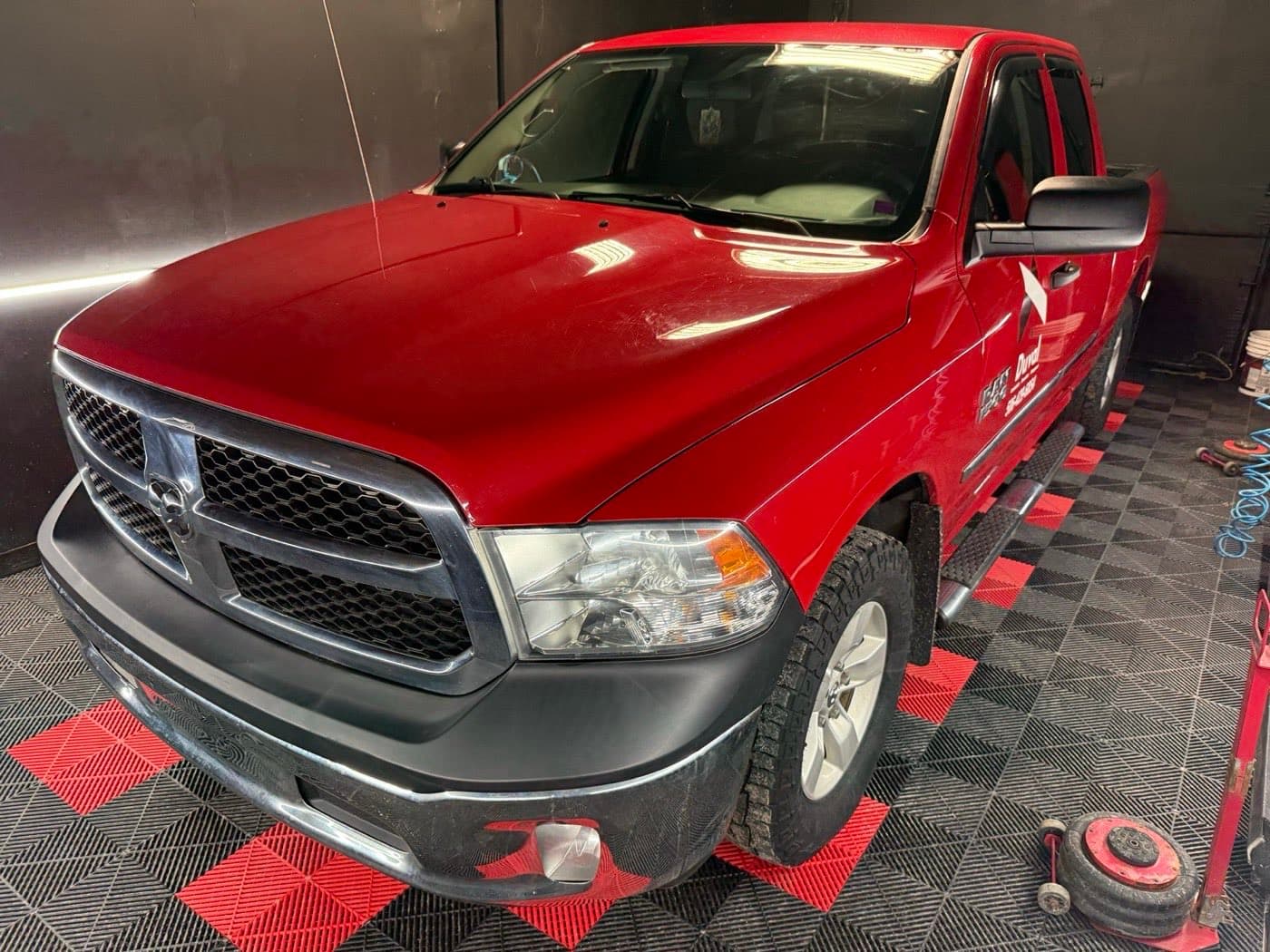 Red Ram pickup gleaming after a wash at PitStop & Go