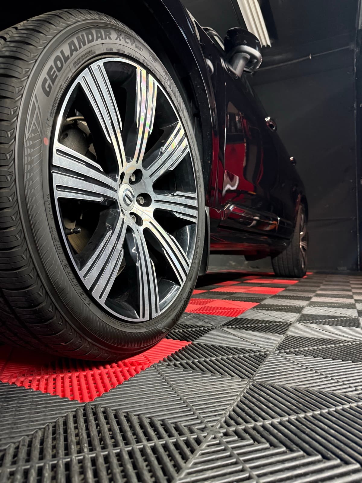 A freshly fitted wheel and tire back on the car in the PitStop & Go bay